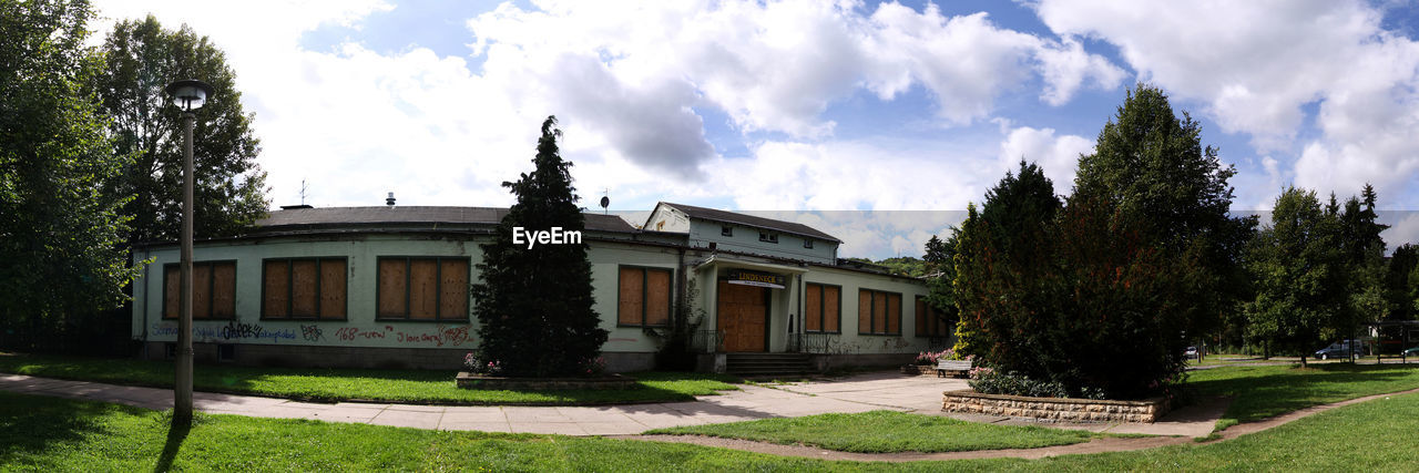 BUILT STRUCTURE WITH TREES IN BACKGROUND