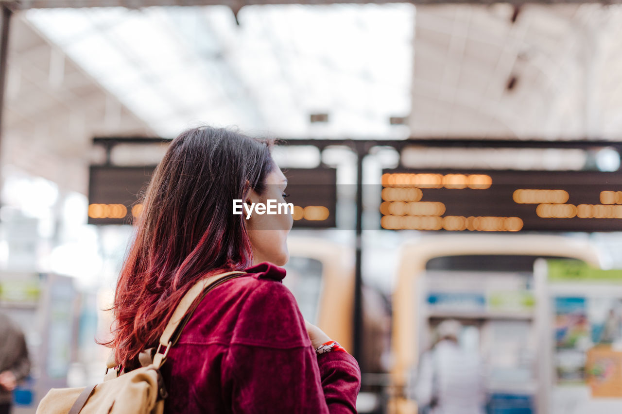 Close-up of woman standing on railroad station