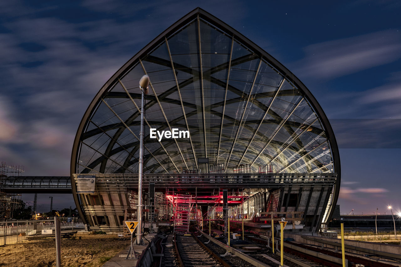 Modern railroad station platform against sky