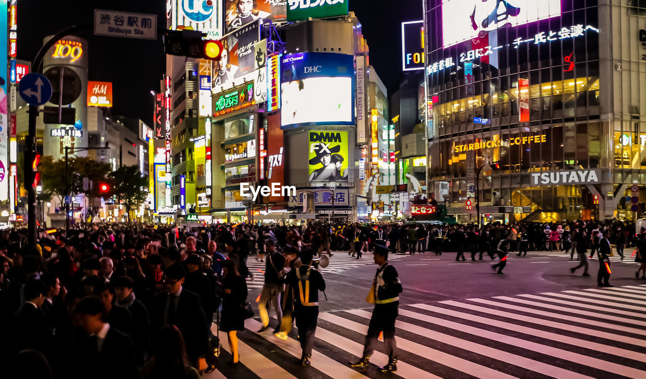 Crowd in city at night