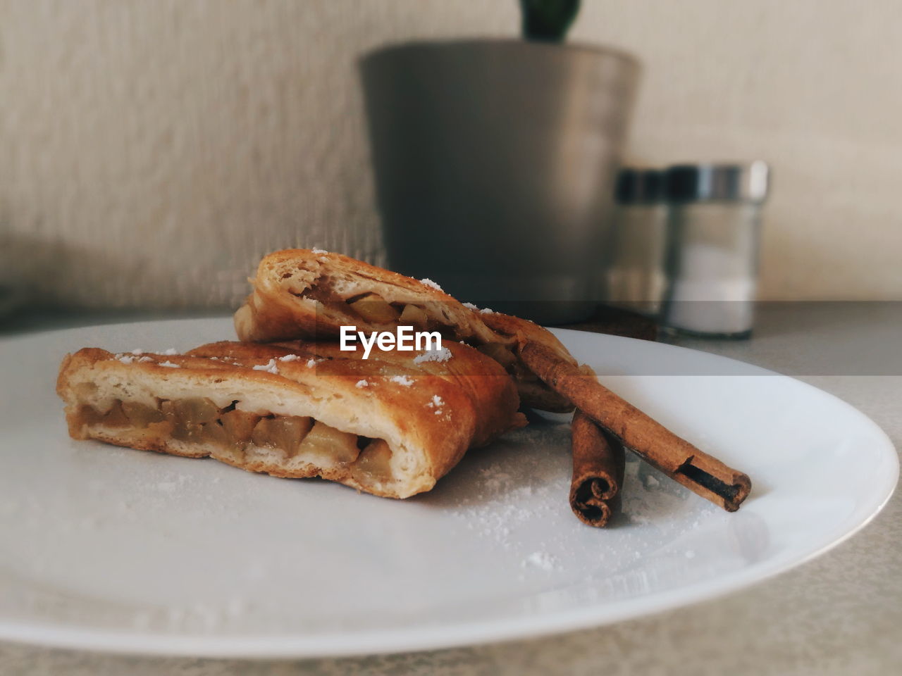 Close-up of meat with cinnamon in plate on table