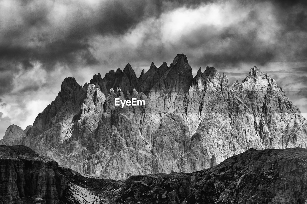 Scenic view of tre cime di lavaredo at dolomites against cloudy sky