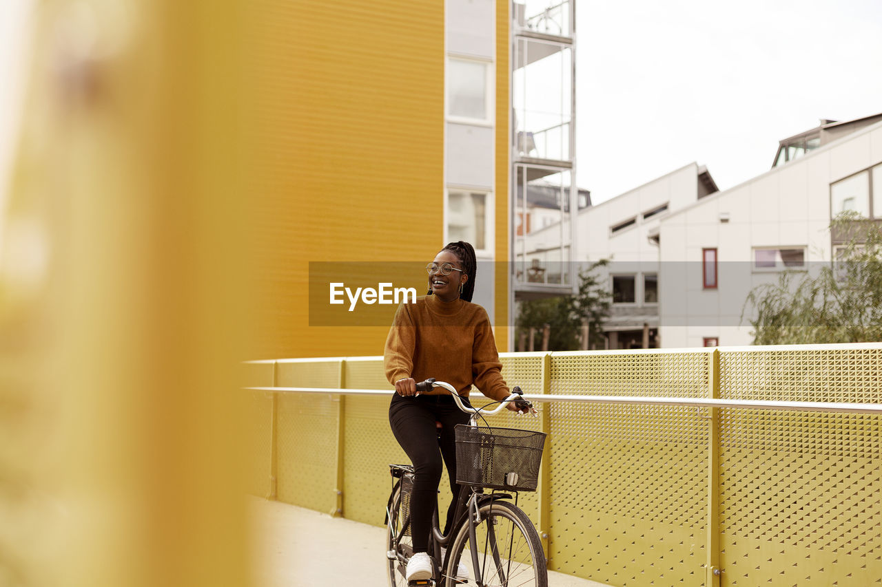 View of young woman cycling