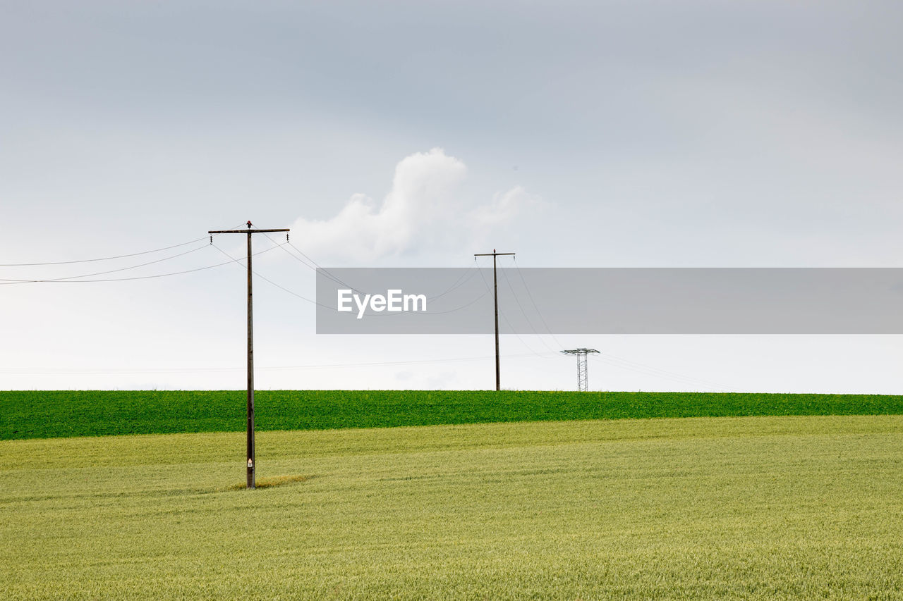 ELECTRICITY PYLON ON FIELD