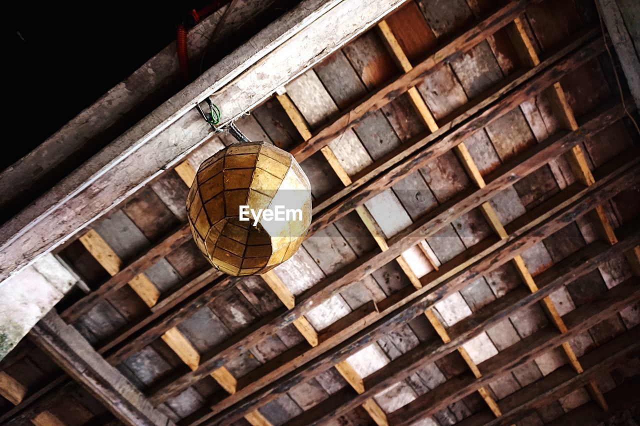 Low angle view of lantern hanging from ceiling