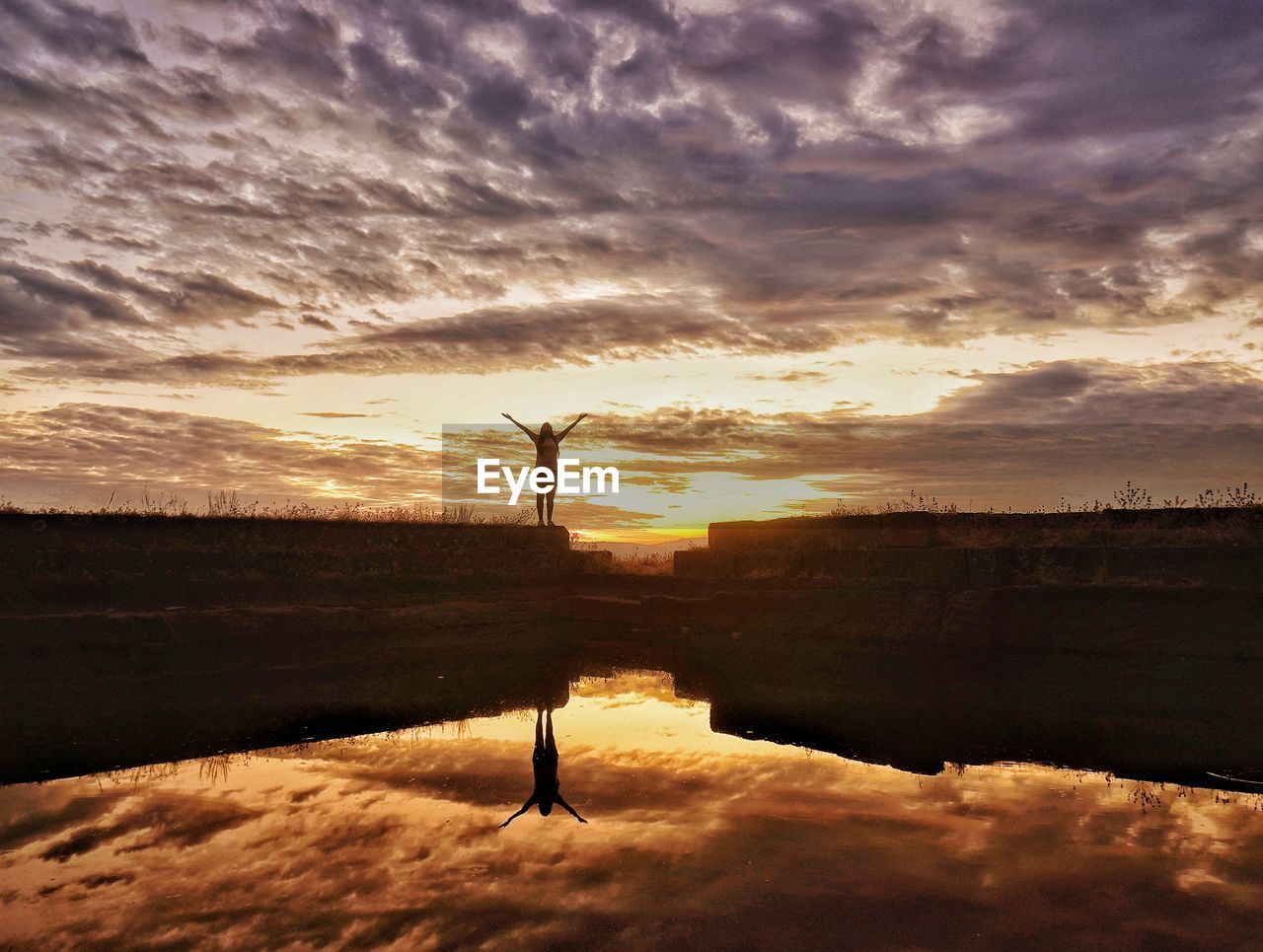 SCENIC VIEW OF SUNSET OVER LAKE