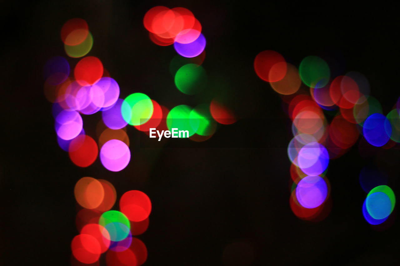 Defocused image of illuminated colorful lights