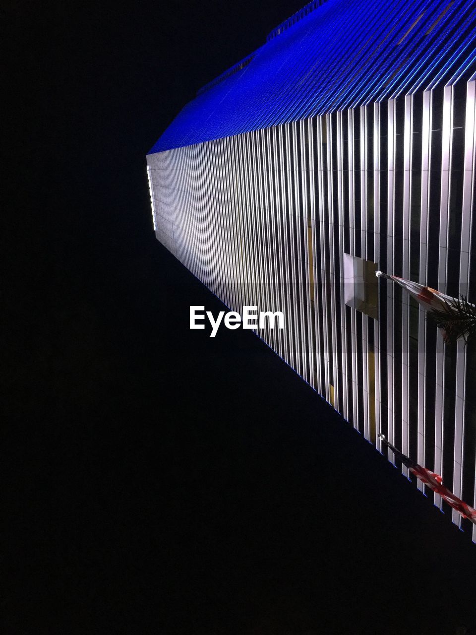 LOW ANGLE VIEW OF ILLUMINATED LIGHTS AT NIGHT