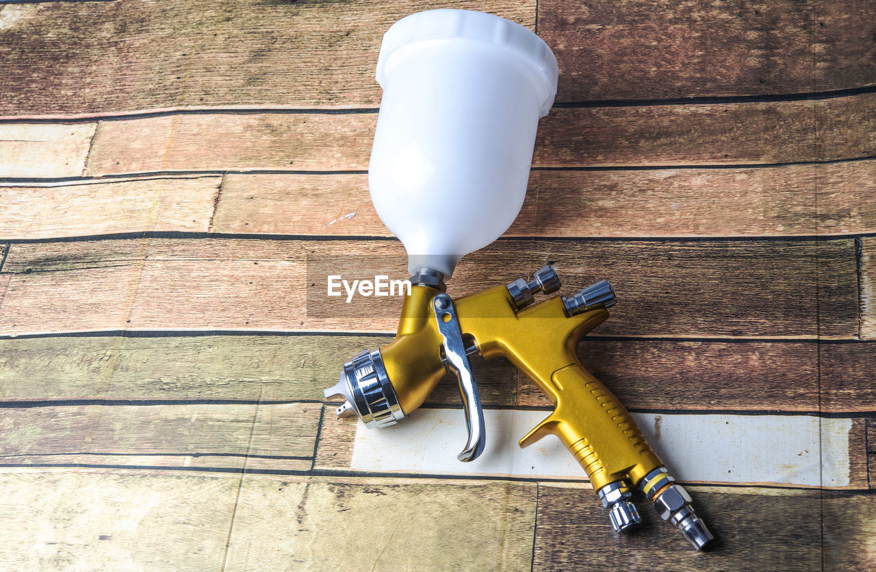 yellow, wood, equipment, no people, still life, work tool, high angle view, wall - building feature