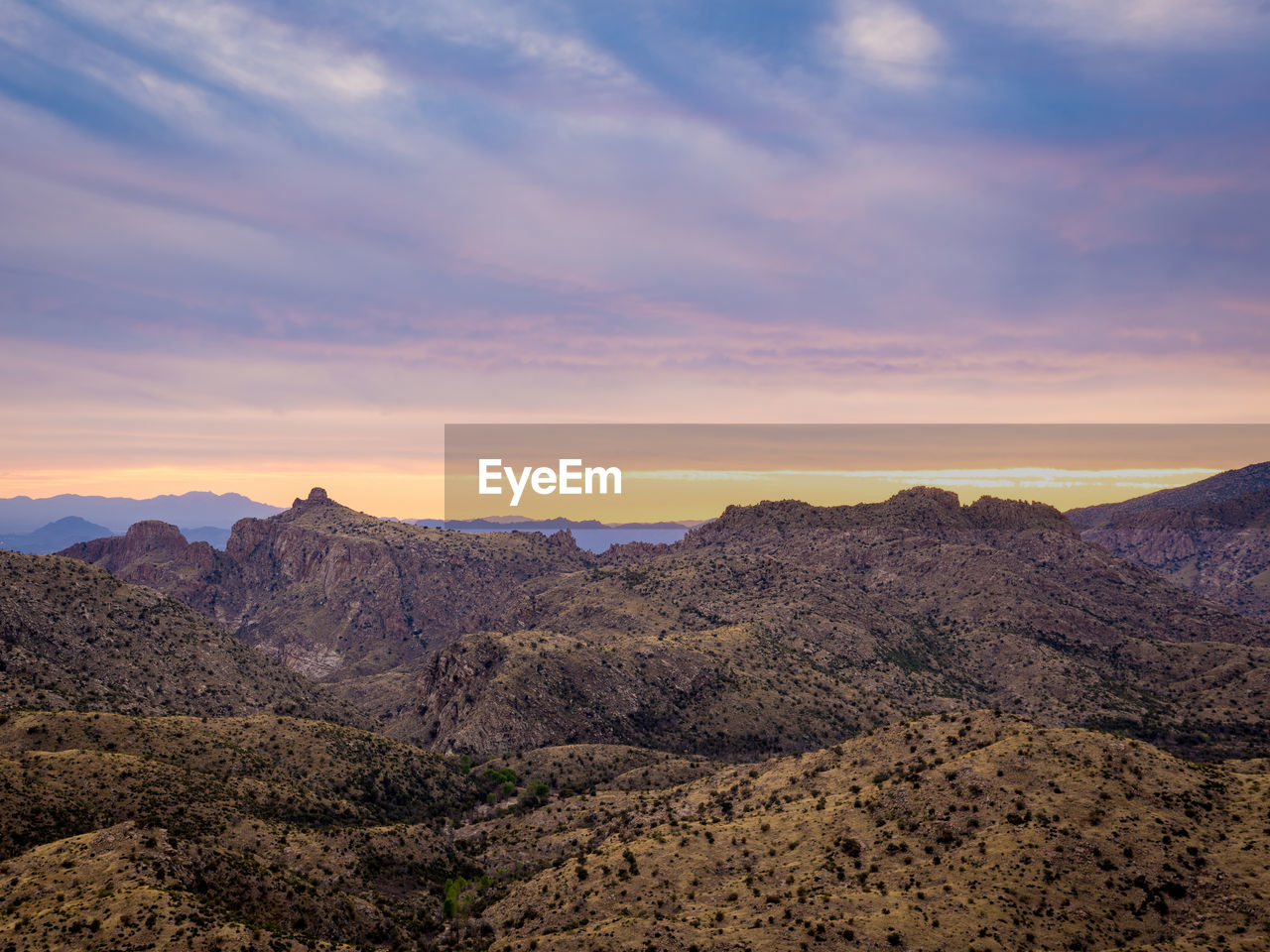 Scenic view of mountains against sky during sunset