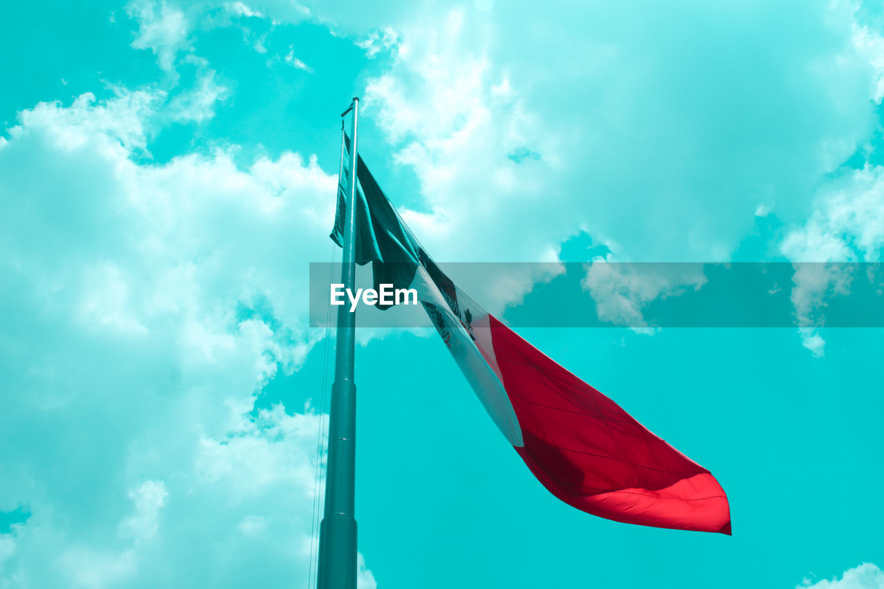 cloud, flag, sky, environment, nature, wind, blue, patriotism, no people, low angle view, red, outdoors, day, sunlight