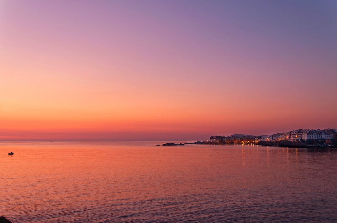 Scenic view of sea at sunset