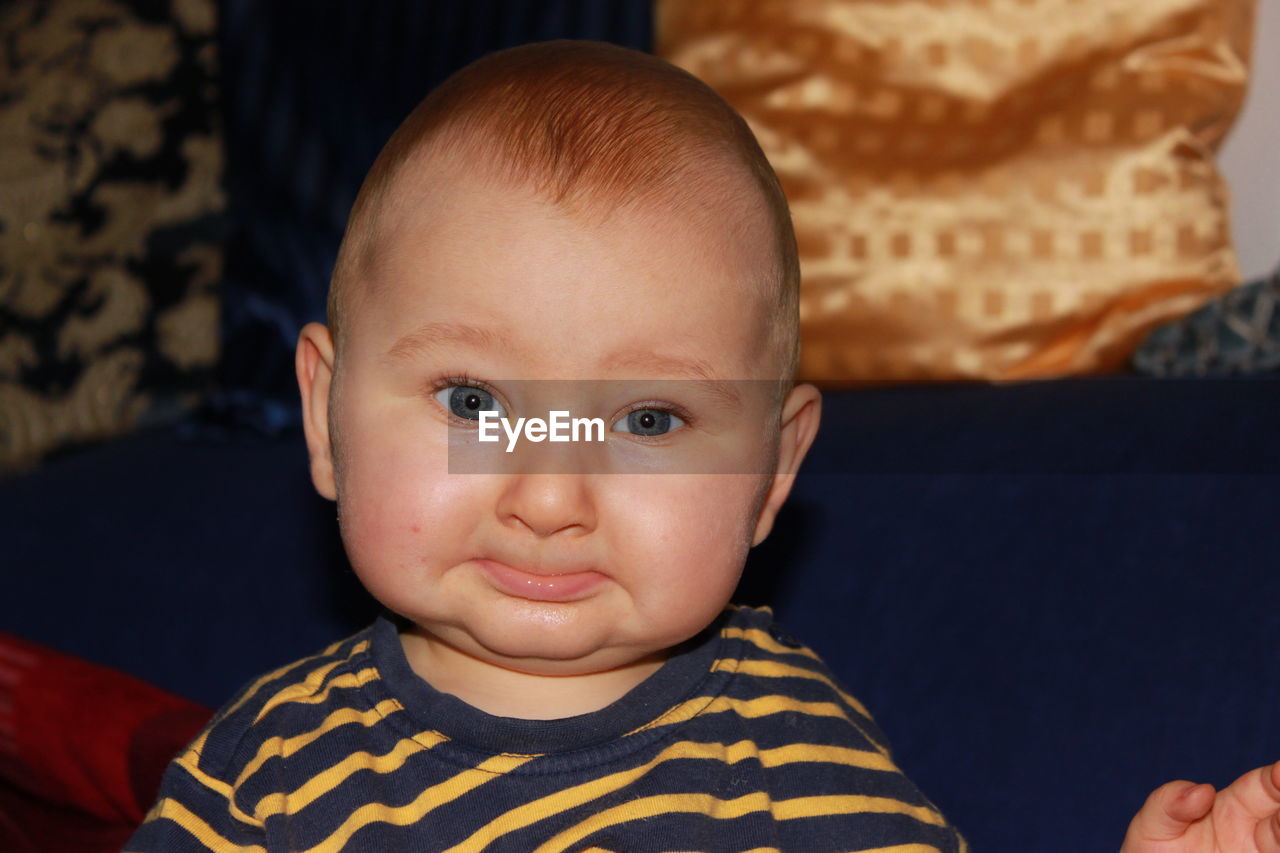 Portrait of cute baby boy at home