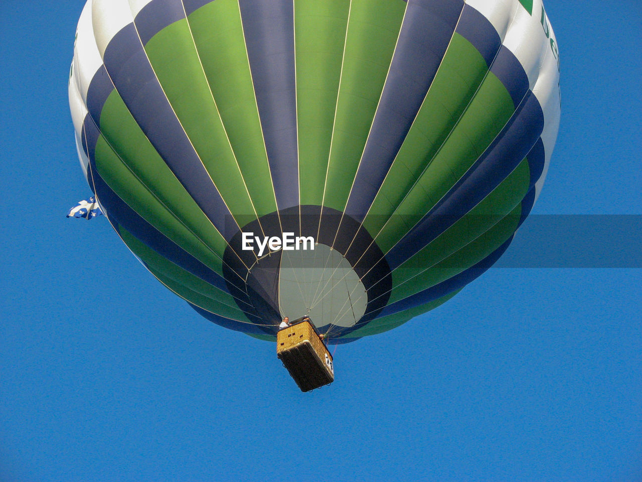 LOW ANGLE VIEW OF HOT AIR BALLOON AGAINST BLUE SKY