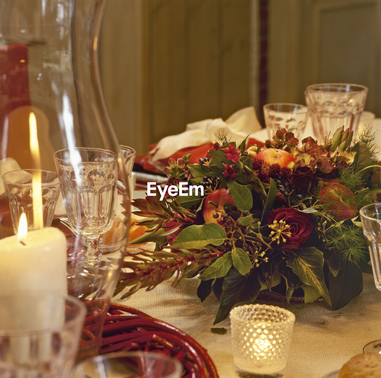 Festive table setting with a vase with a stylish bouquet of flowers. catering concept