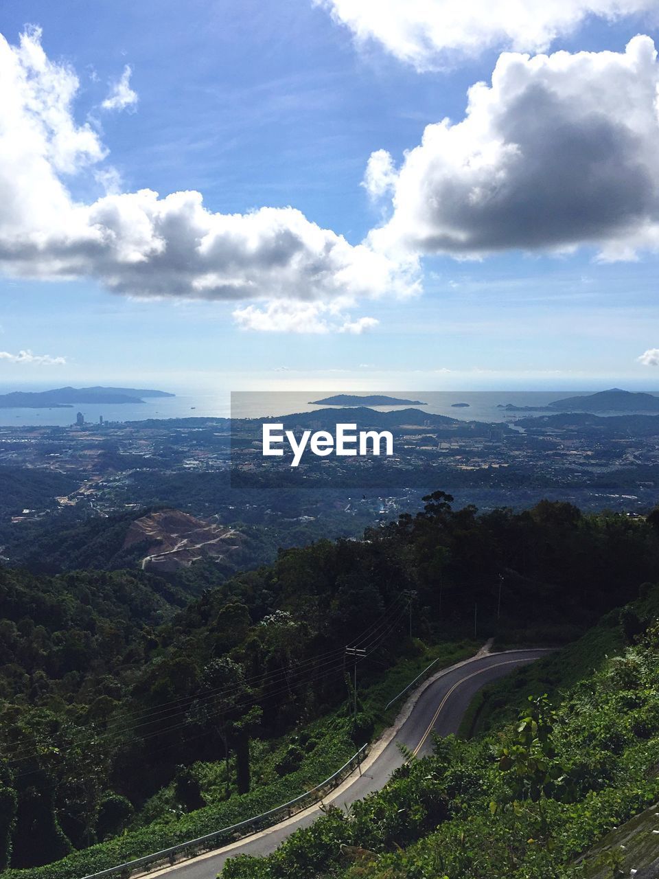 AERIAL VIEW OF LANDSCAPE WITH MOUNTAIN RANGE IN BACKGROUND