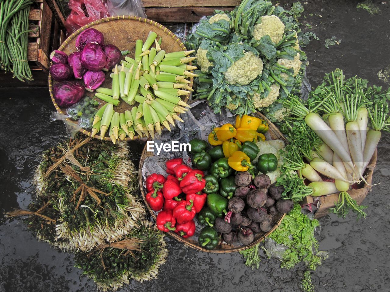 High angle view of vegetables in baskets at market stall