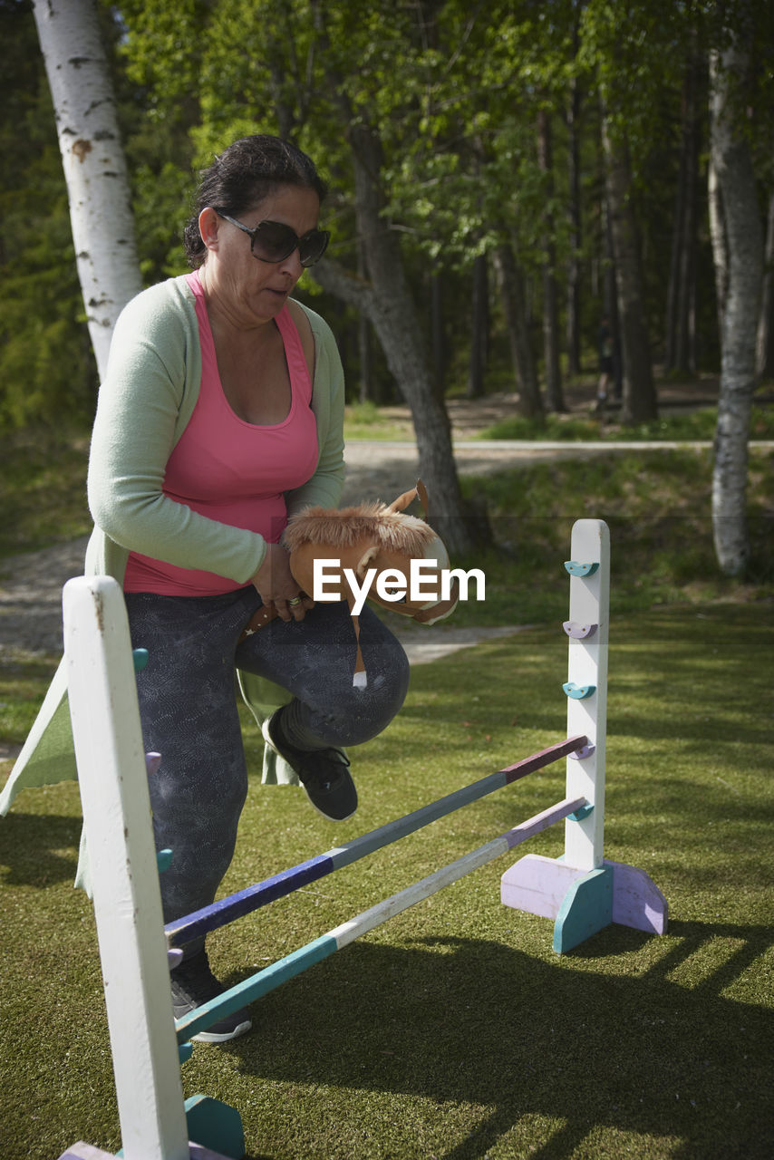 Woman participating in hobby horse competition