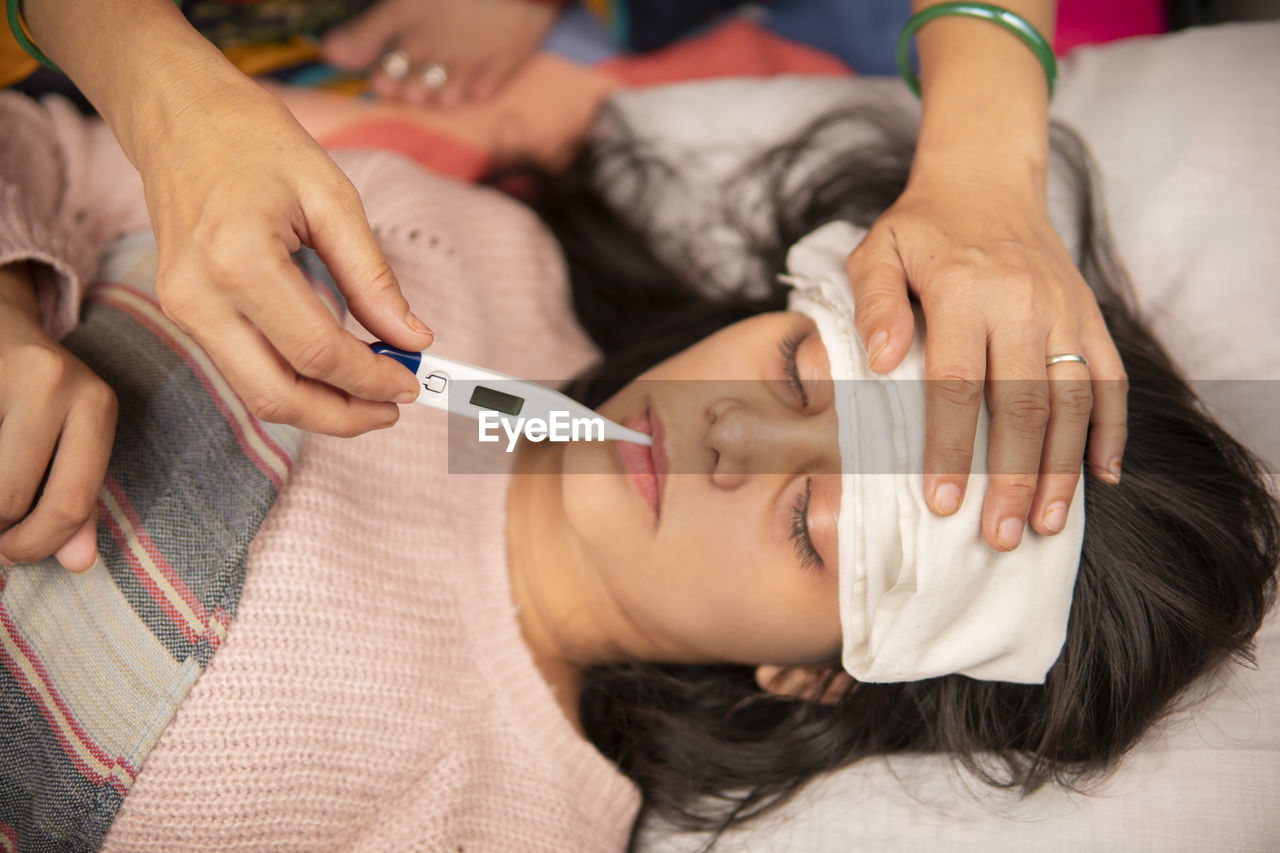 midsection of doctor examining patient in hospital