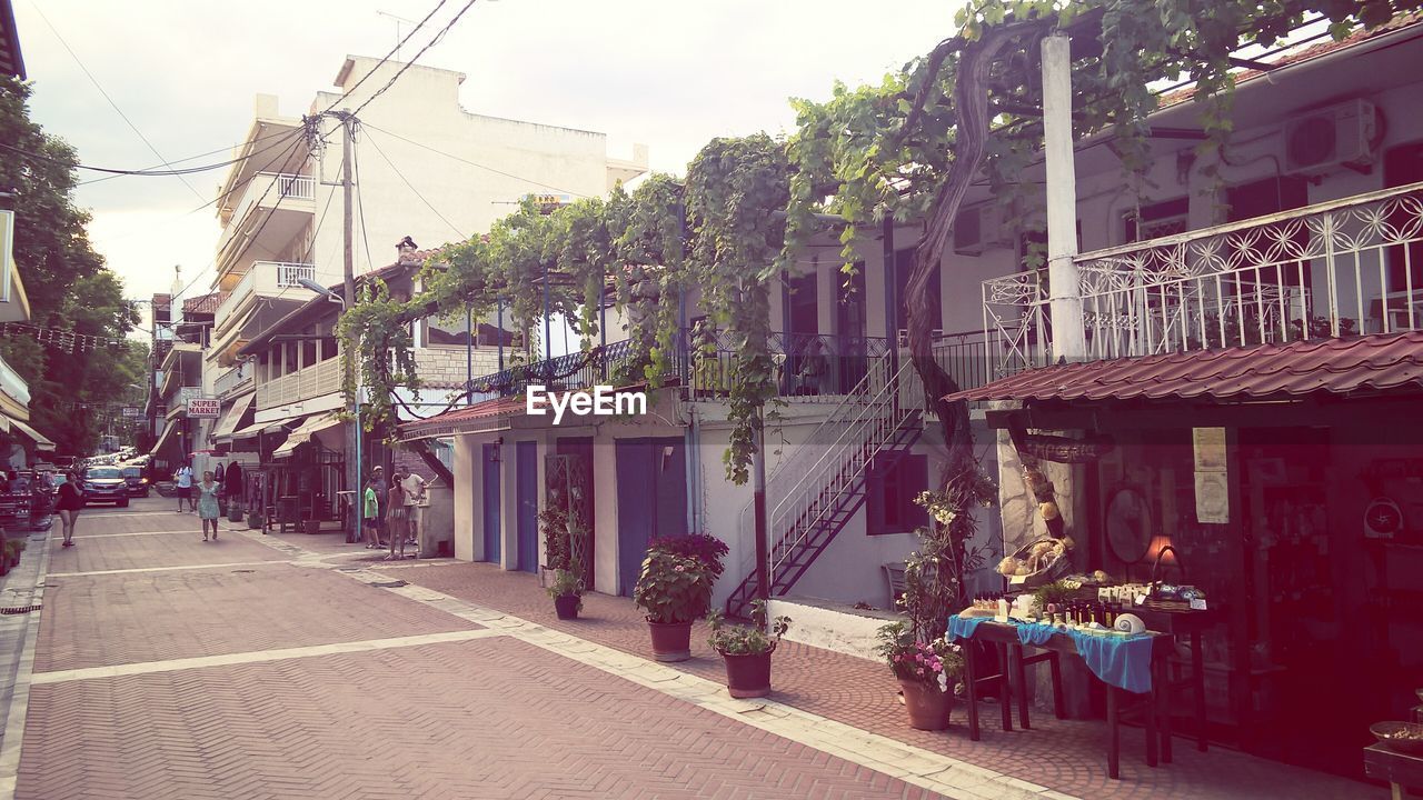 VIEW OF BUILDINGS ALONG STREET