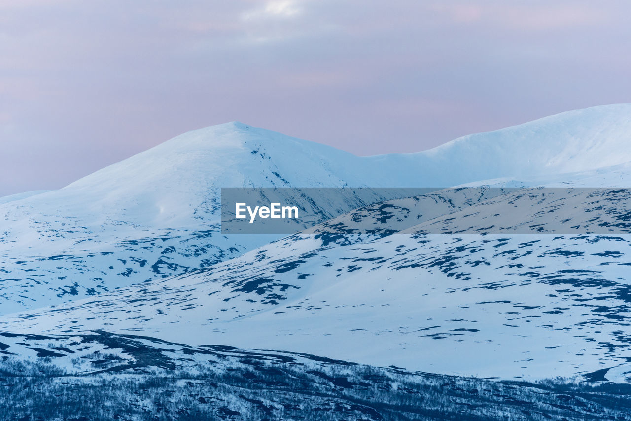 Scenic view of snowcapped mountain against sky