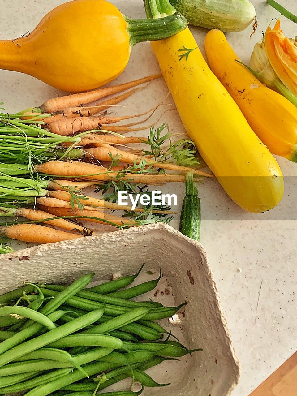 food and drink, food, healthy eating, vegetable, wellbeing, freshness, produce, carrot, root vegetable, high angle view, no people, herb, still life, indoors, organic, yellow, raw food, ingredient, fruit, plant, green, onion, wood, studio shot, spice, cutting board, summer squash, asparagus