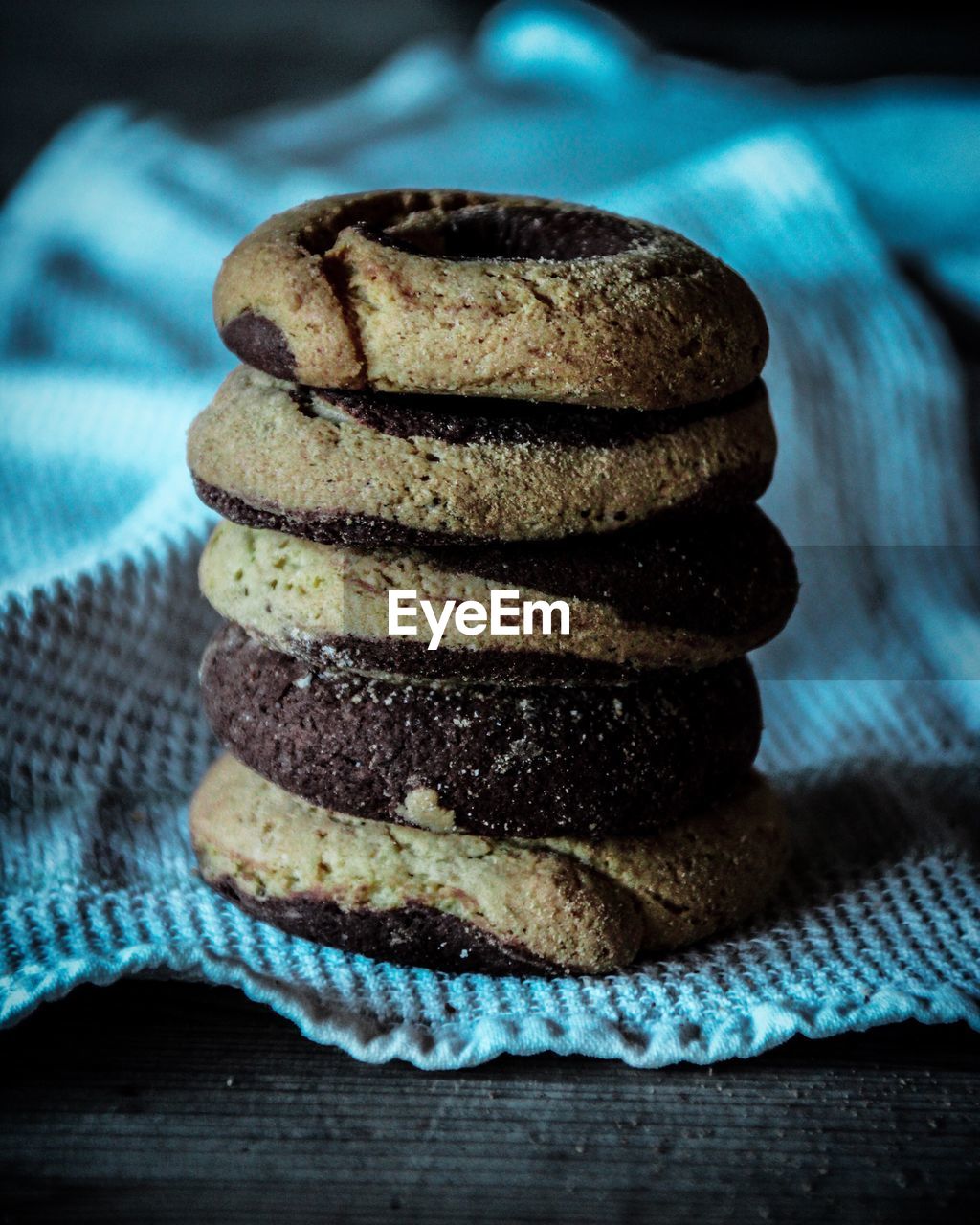 Close-up of biscuits stacked on fabric