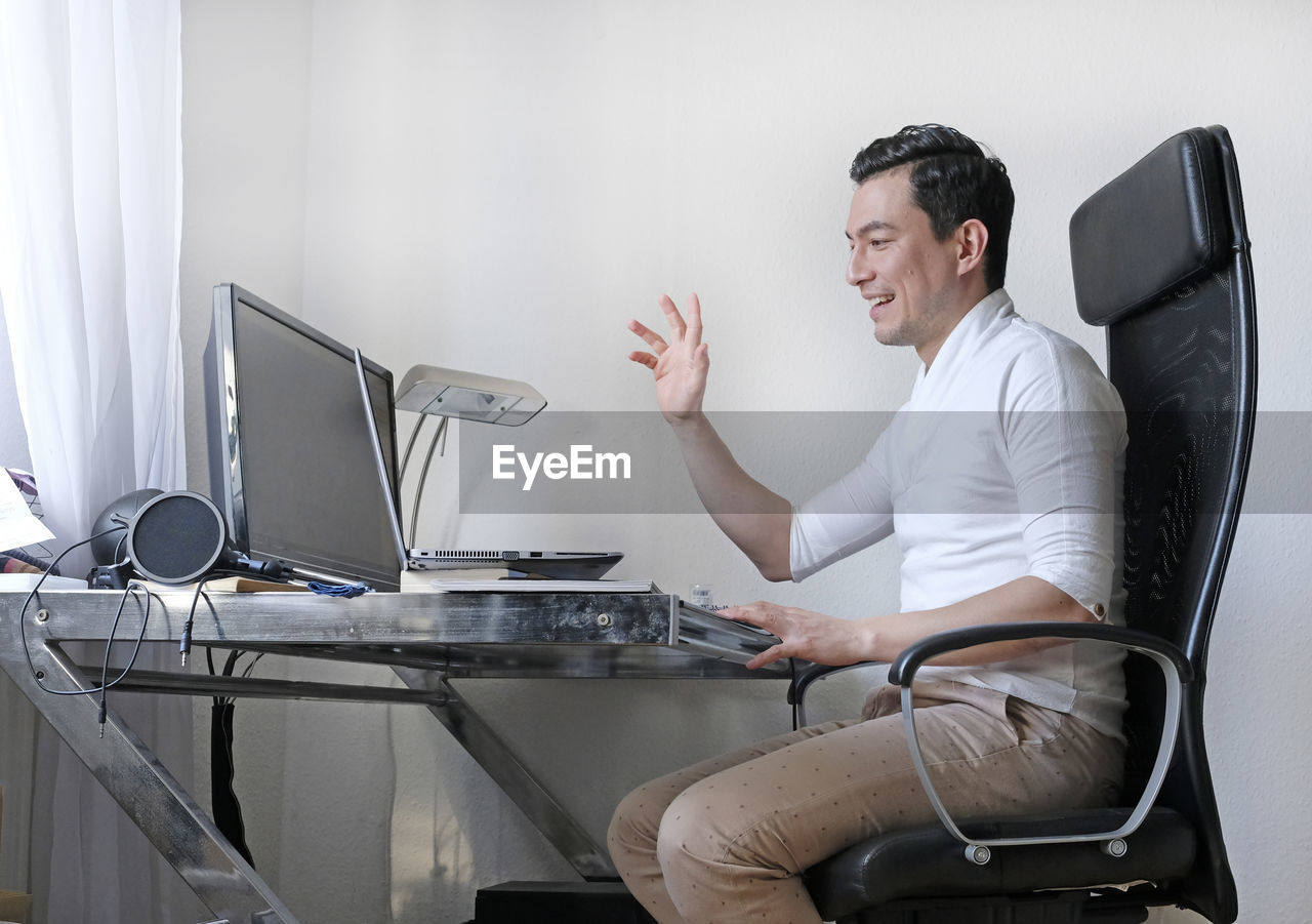 Man using computer on table