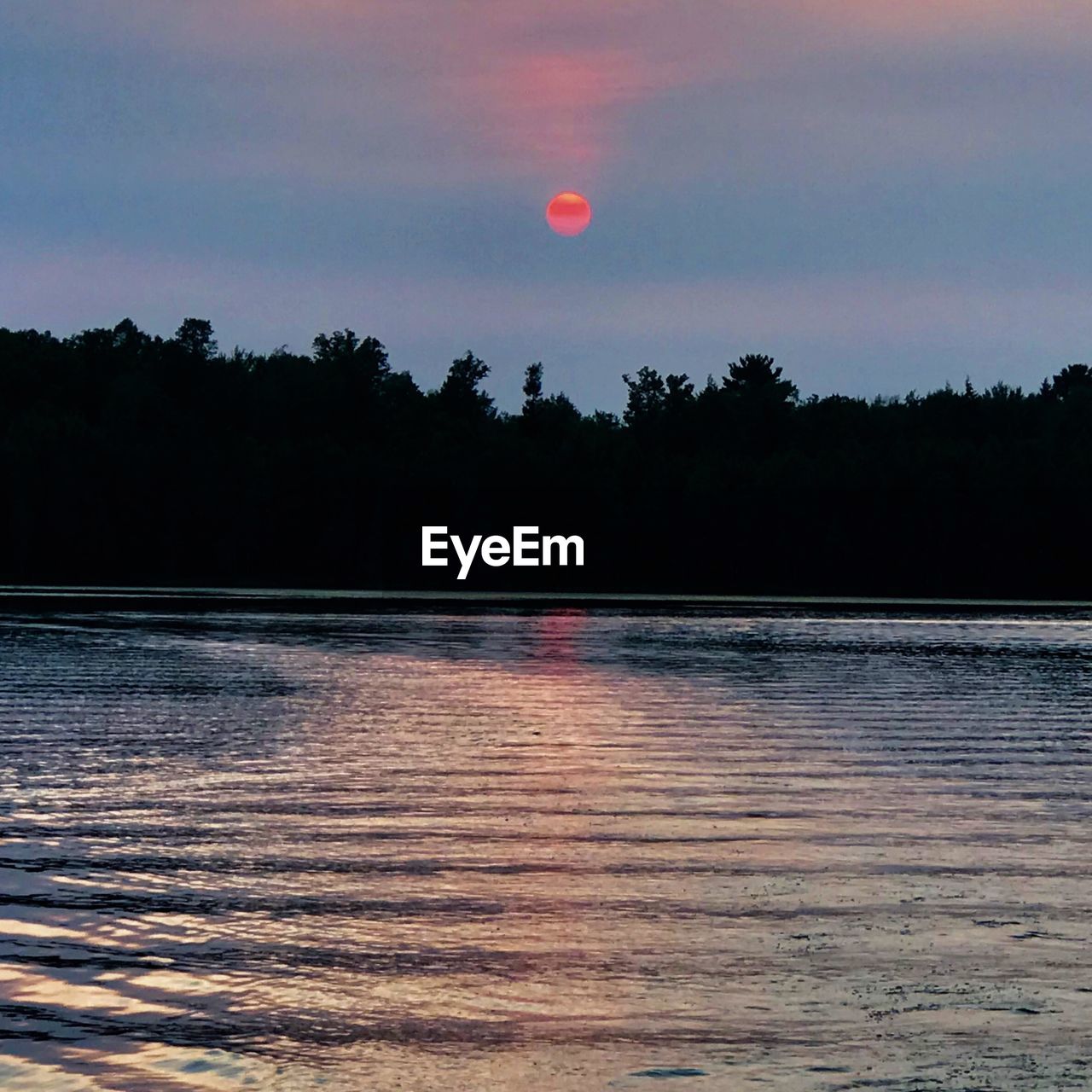 VIEW OF LAKE AGAINST SKY DURING SUNSET