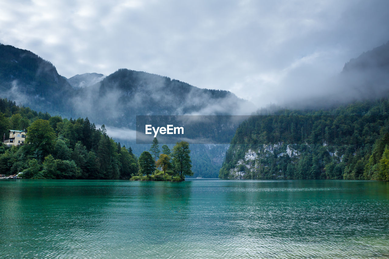 Scenic view of lake and mountains against sky