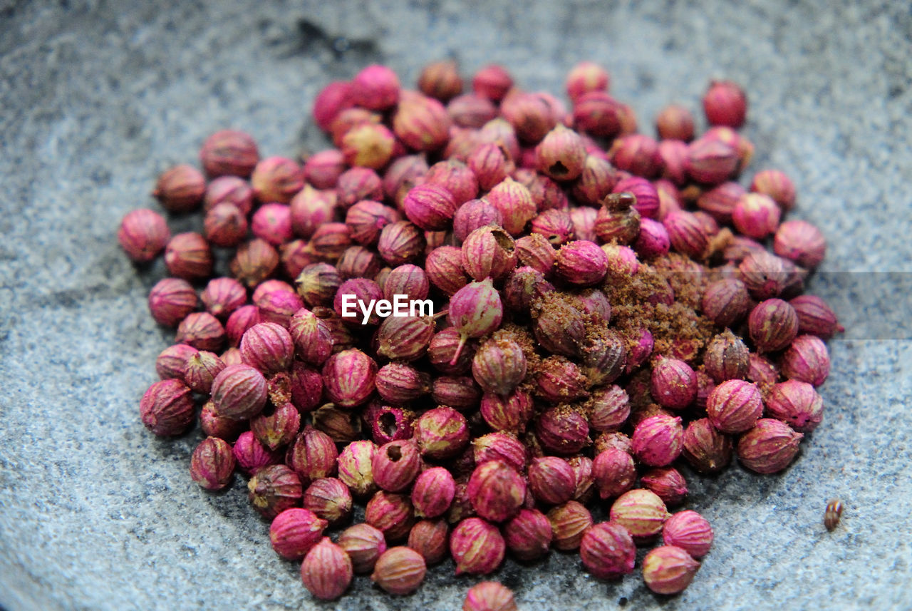 High angle view of coriander seeds heap