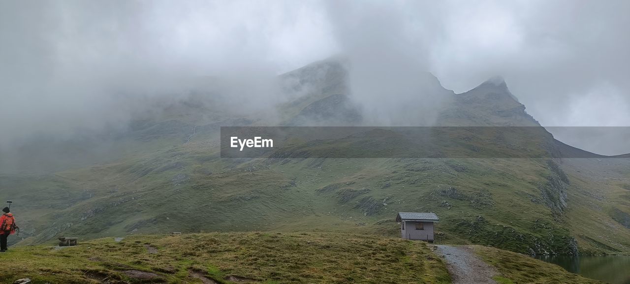 rear view of man hiking on mountain