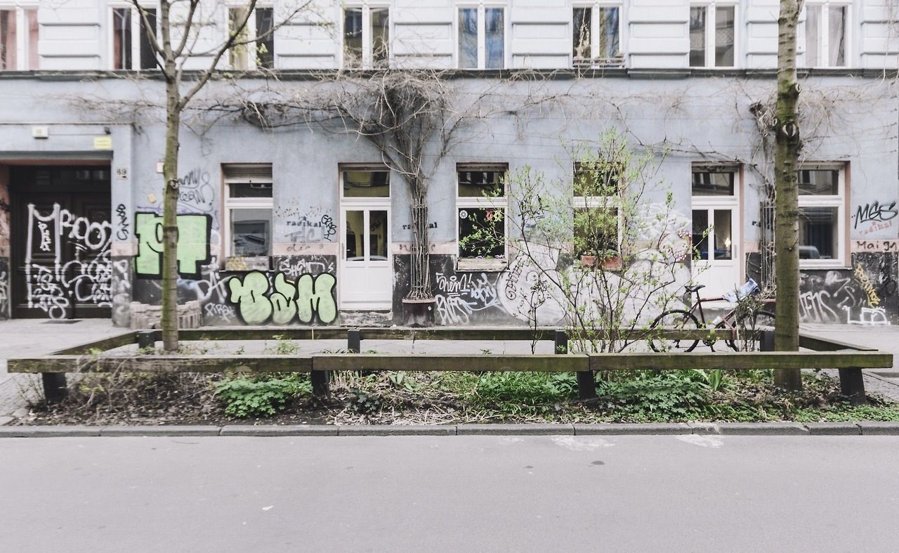 Bicycle parked in front of apartment building