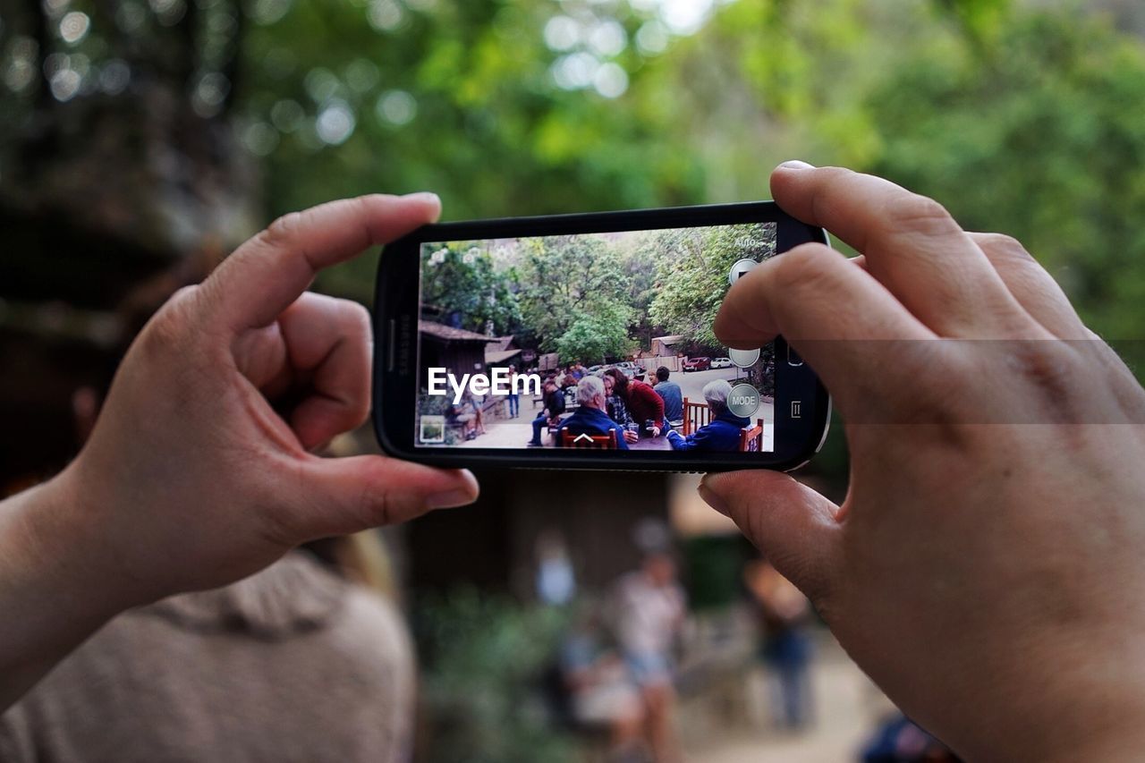 Man photographing with smart phone