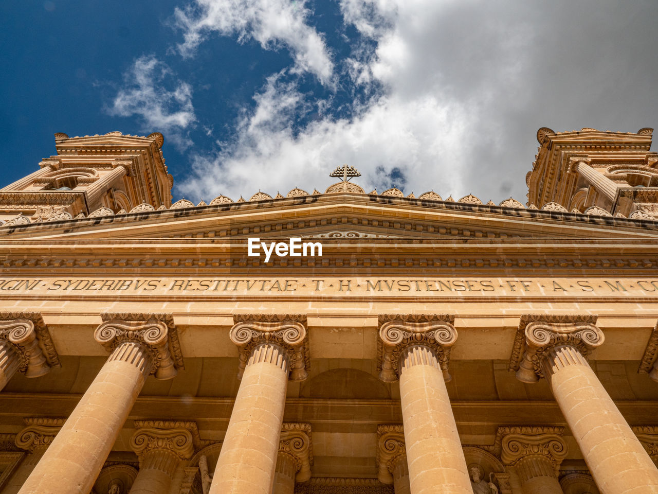 LOW ANGLE VIEW OF PALACE AGAINST CLOUDY SKY