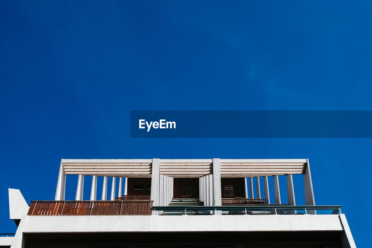 Low angle view of building against blue sky