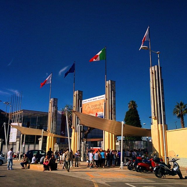 LOW ANGLE VIEW OF BUILDINGS AGAINST BLUE SKY