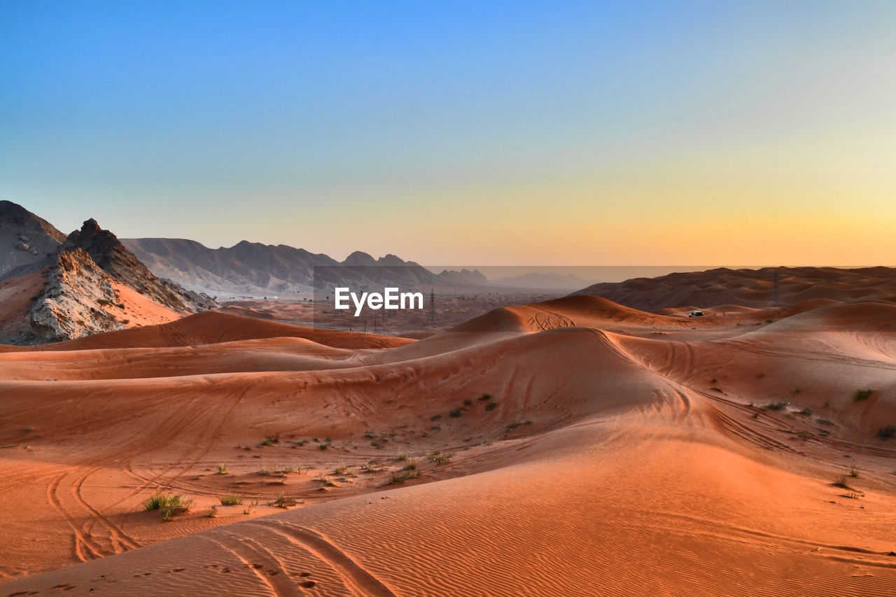 Scenic view of desert against clear sky