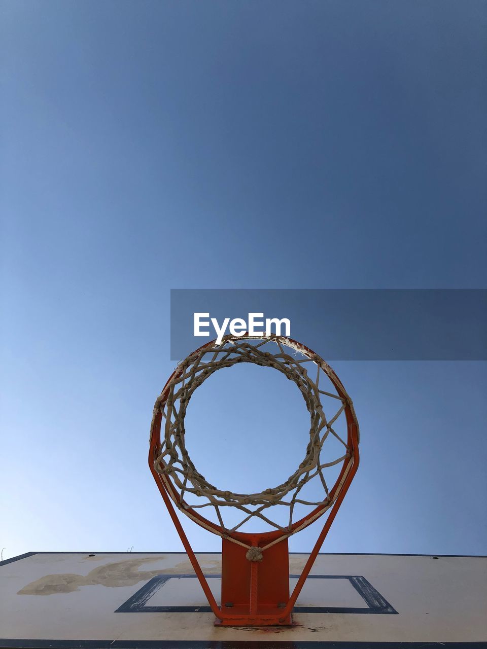 Low angle view of basketball hoop against clear sky