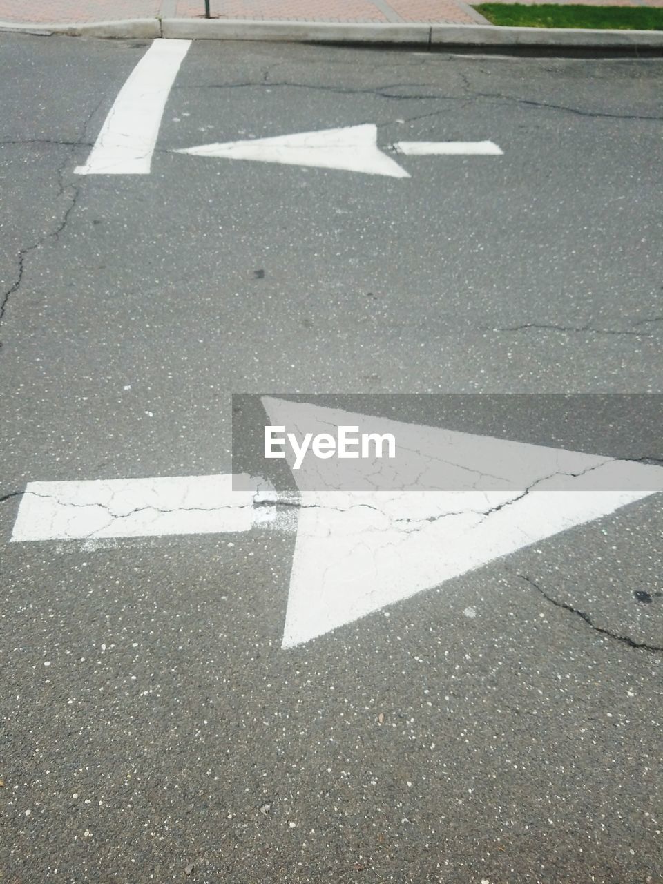 ARROW SIGN ON ROAD
