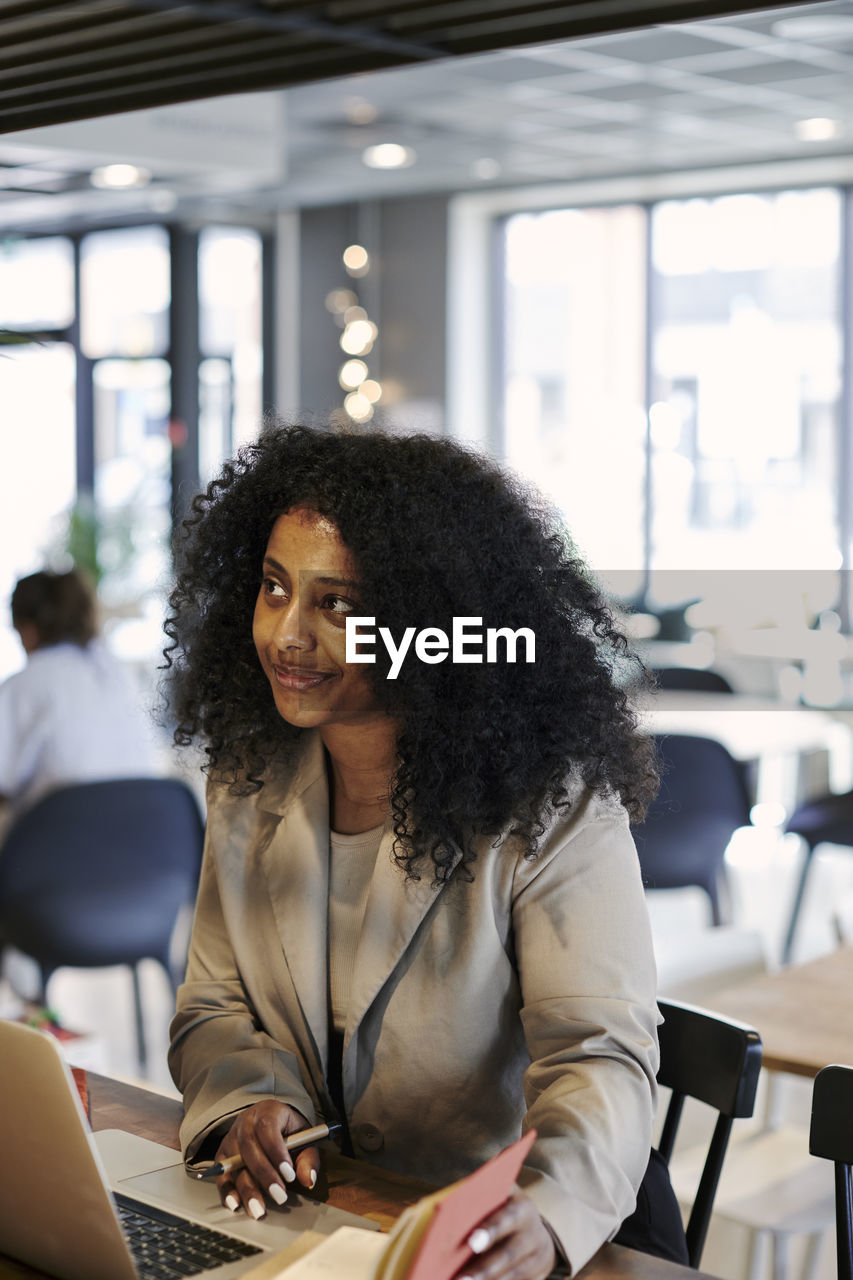 Woman working in cafe