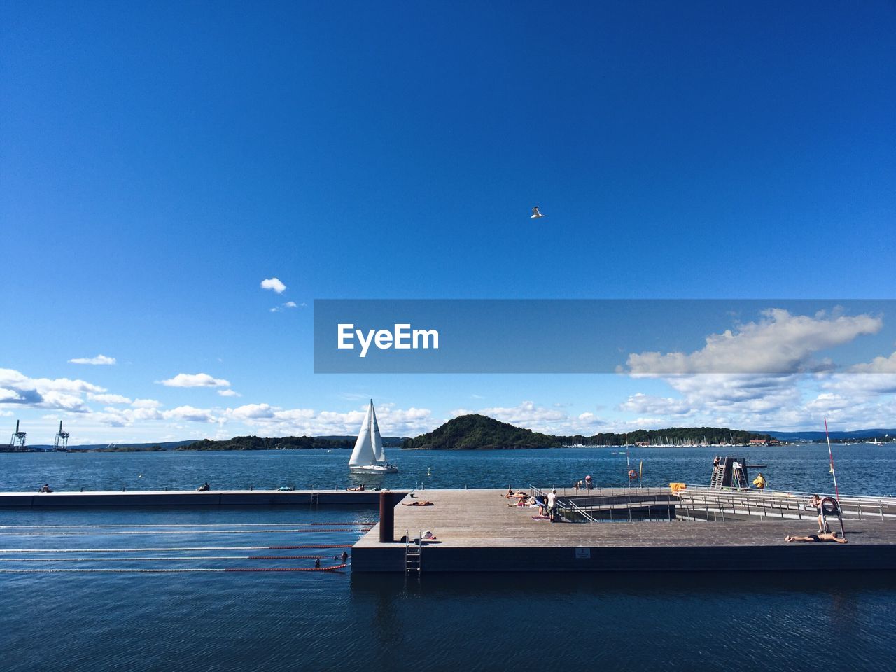 Scenic view of sea against blue sky