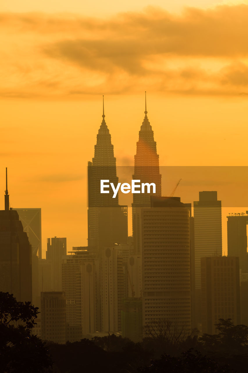 SILHOUETTE OF BUILDINGS AT SUNSET