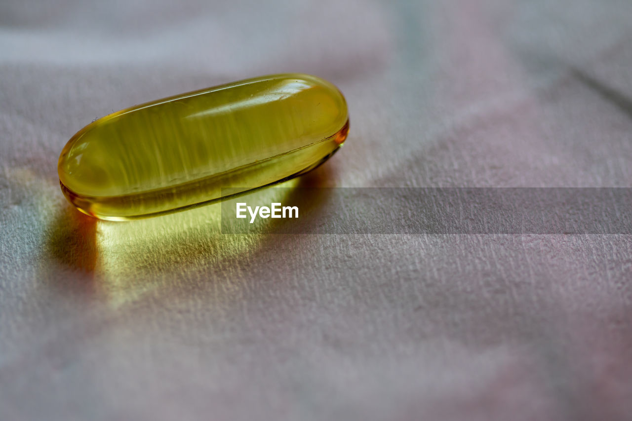 Close-up of capsule on table