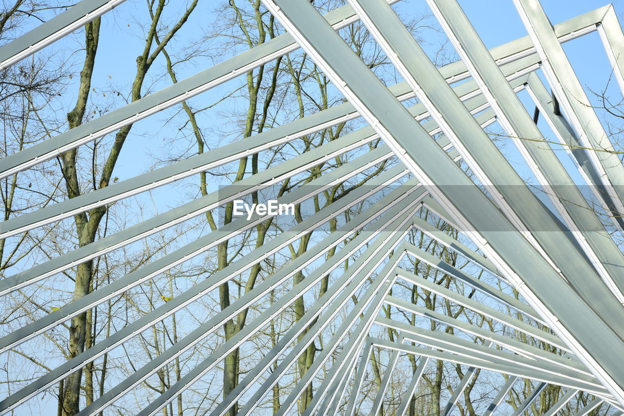 LOW ANGLE VIEW OF MODERN GLASS CEILING