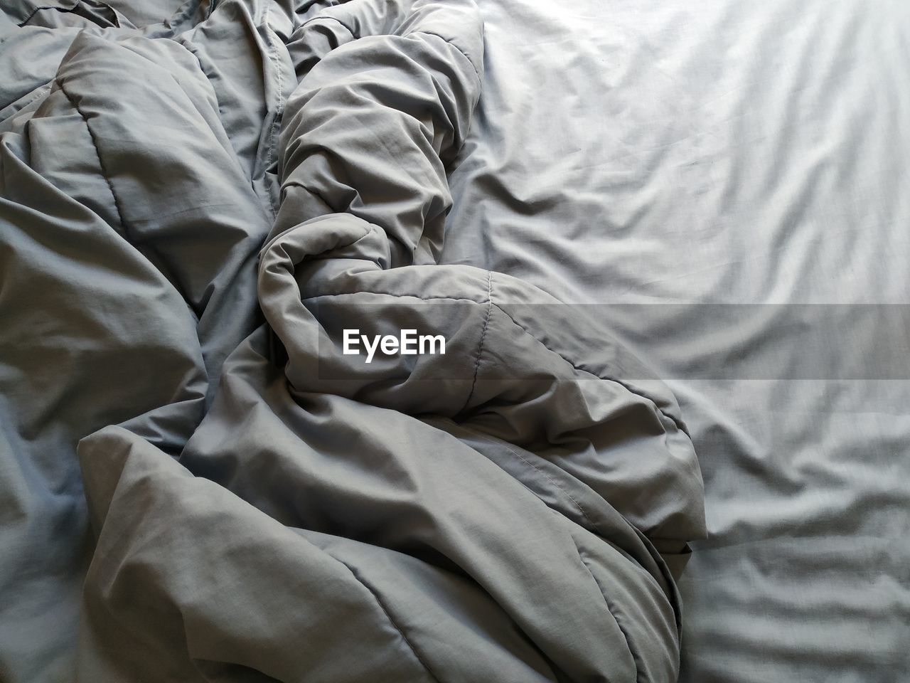 High angle view of crumpled blanket on bed at home