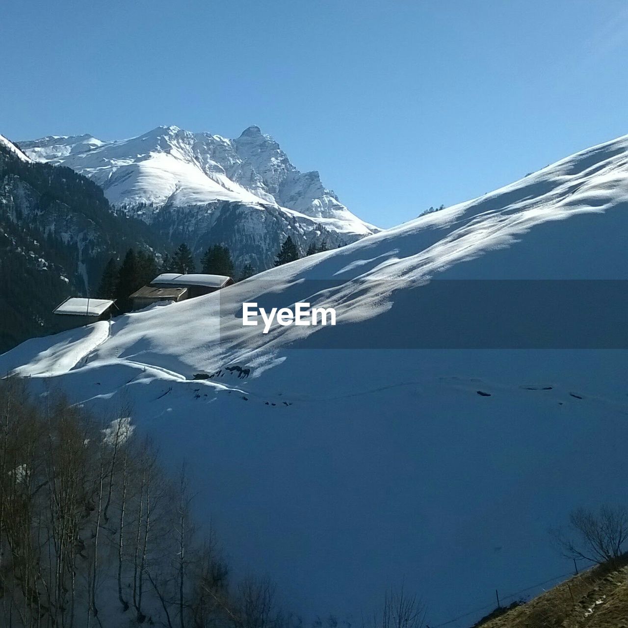 Scenic view of snow mountains against sky