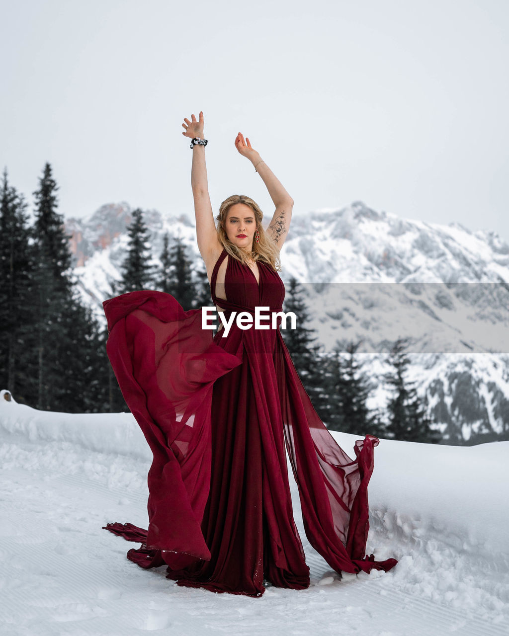 Full length of woman standing on snow