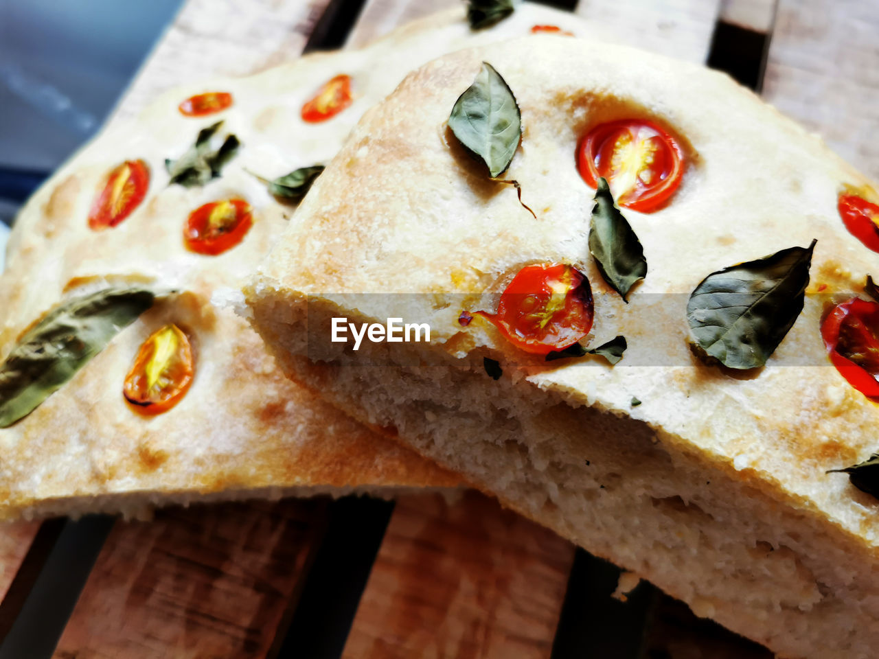 food, food and drink, dish, cuisine, pizza, fast food, italian food, freshness, vegetable, cheese, no people, fruit, dairy, close-up, olive, tomato, flatbread, healthy eating, produce, bread, indoors, high angle view, meal, slice, wood