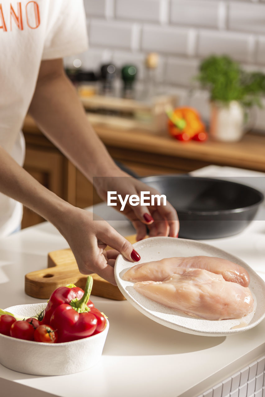 Cooking dinner with chicken and vegetables